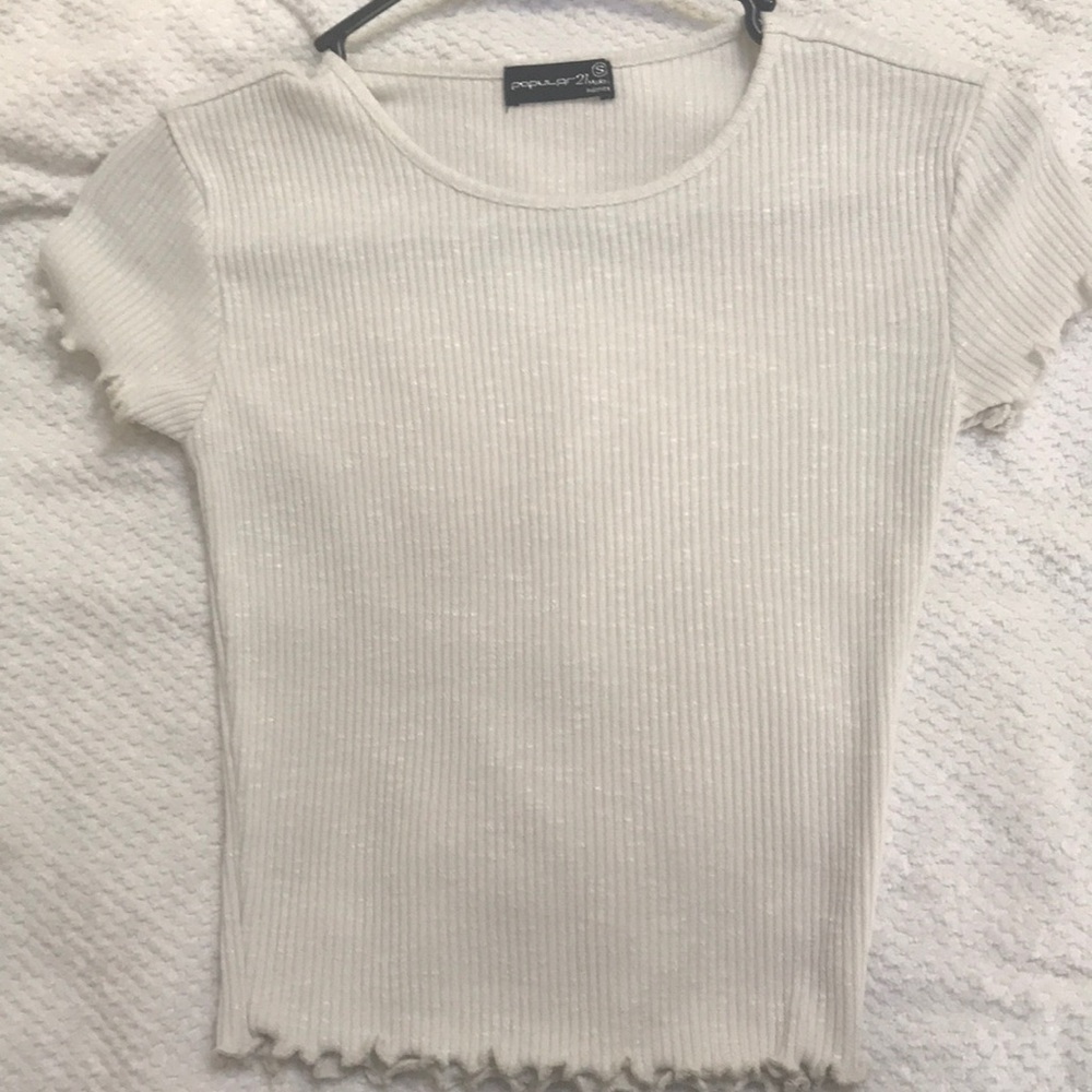 White ribbed shirt with ruffle